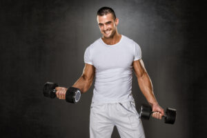 Handsome muscular man exercising after TRT